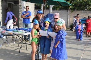 Afton and her relay team with the help of Camille Bennett sang the National Anthem.