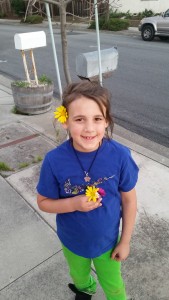 Pretty much every single Sunday we go on a family walk.  Keri's favorite thing to do is pick flowers along our walk.  Here she is sporting some of the flowers she picked.  So cute!