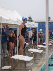 Alix's first meet was in the rain.  I volunteered to be a timer, that meant I got to sit under the canopy!  :o)